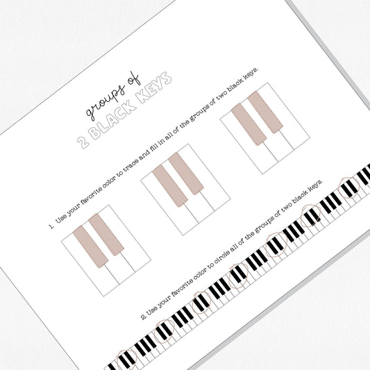 Photo of a music theory worksheet on a neutral colored background.