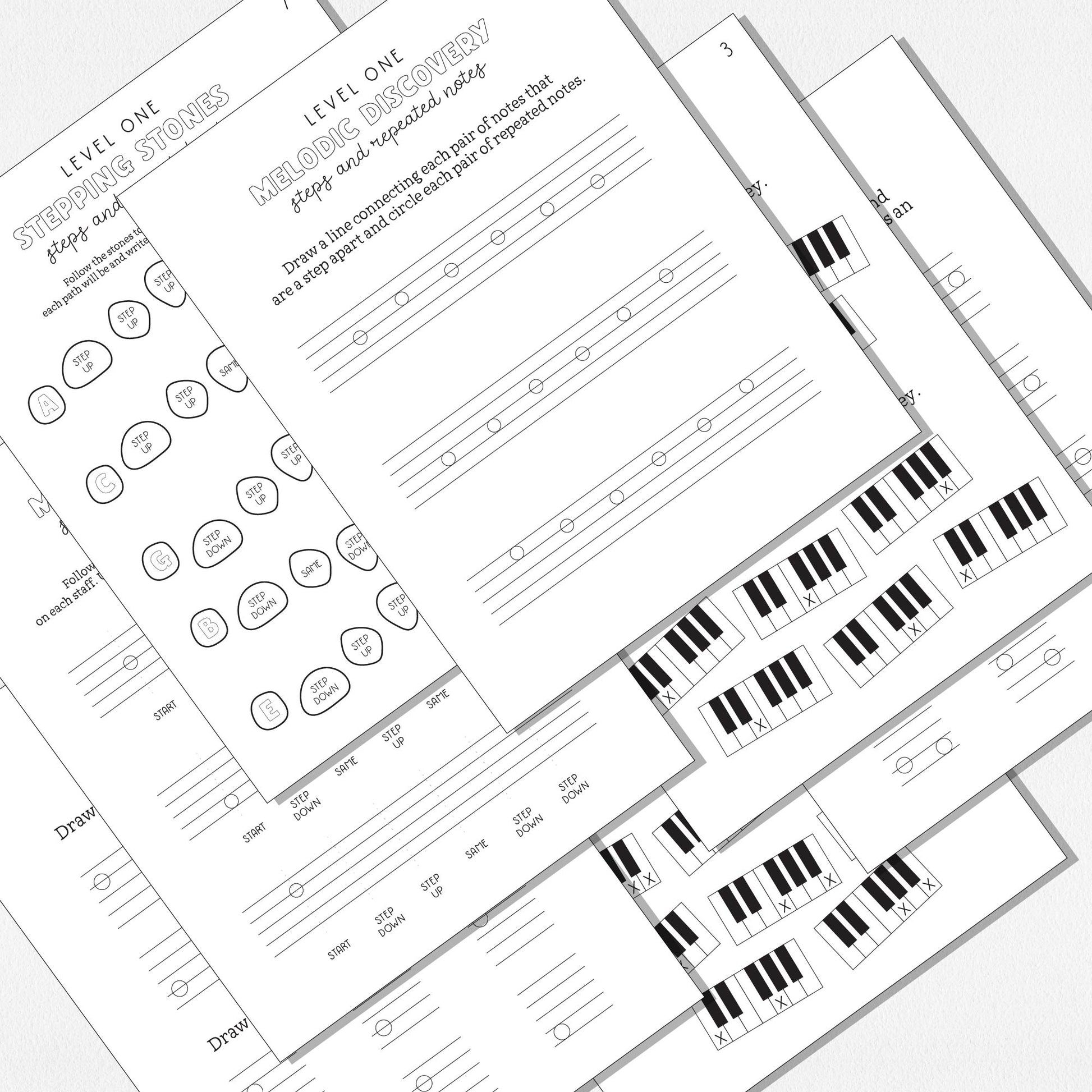 A spread of music theory worksheets shown on a neutral colored background.