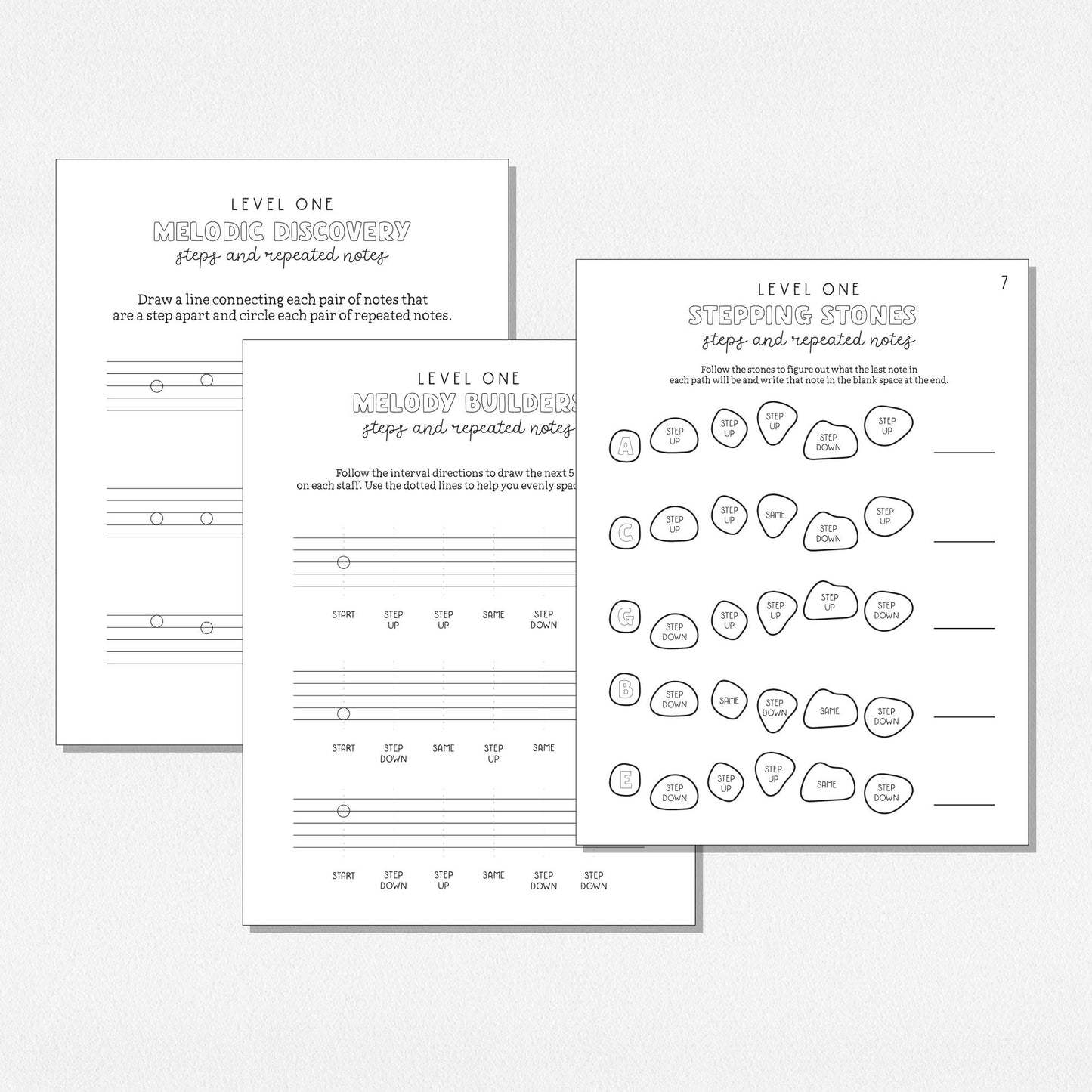 A spread of music theory worksheets shown on a neutral colored background.