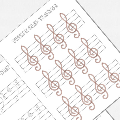 A close up view of two worksheets, one for tracing and drawing treble clefs and one for tracing and drawing bass clefs. Shown on a neutral colored background.