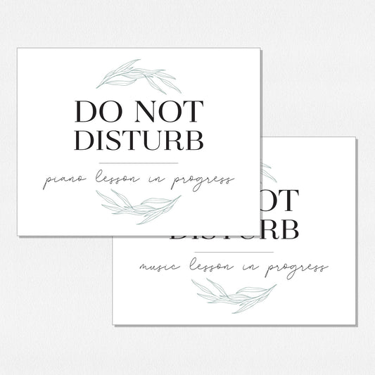 Two overlapping paper prints. The top print reads 'DO NOT DISTURB' with 'piano lesson in progress' below, and the bottom print reads 'DO NOT DISTURB' with 'music lesson in progress' below. Decorated with pale green willow leaf illustrations, arranged on a neutral colored background.