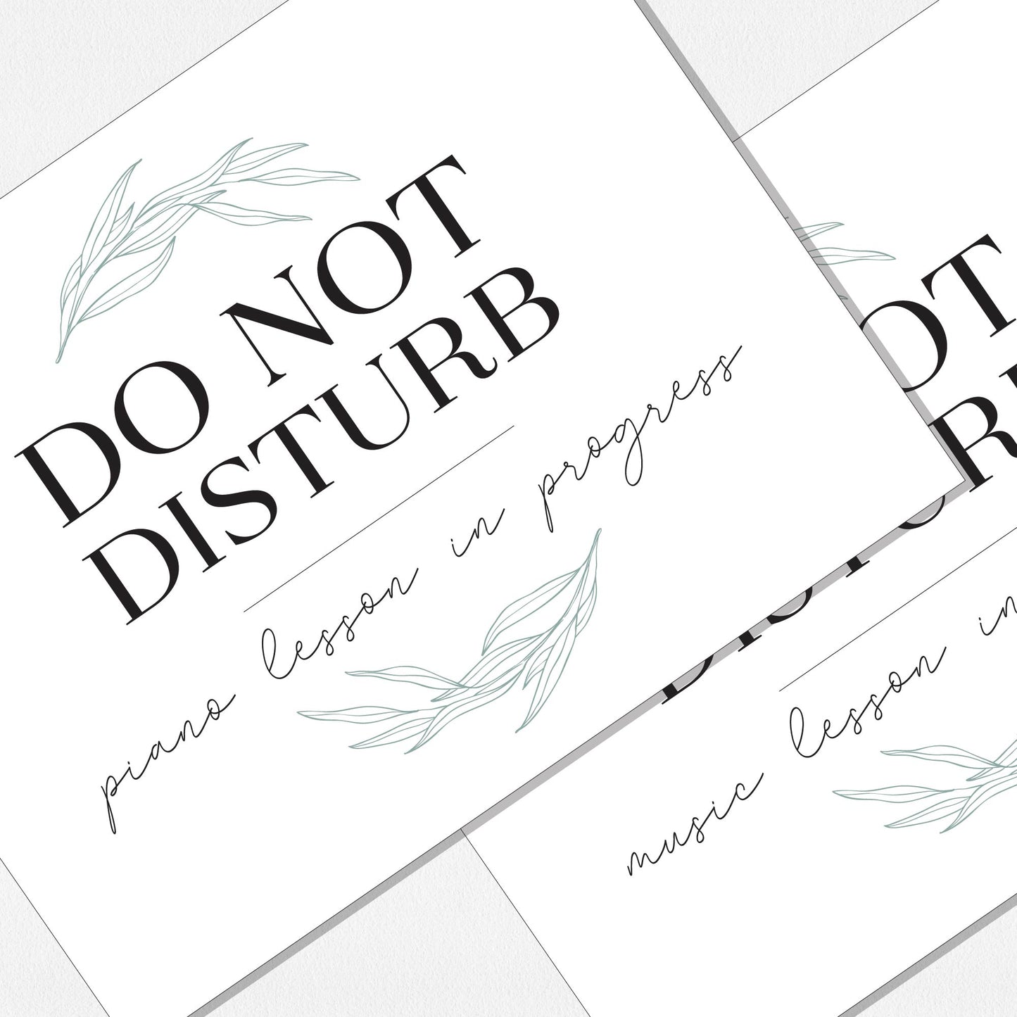 Two overlapping paper prints. The top print reads 'DO NOT DISTURB' with 'piano lesson in progress' below, and the bottom print reads 'DO NOT DISTURB' with 'music lesson in progress' below. Decorated with pale green willow leaf illustrations, arranged on a neutral colored background.