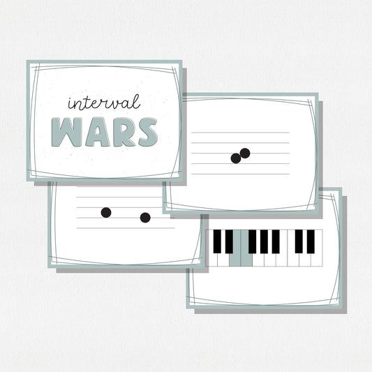 Four square cards of a music card game showing music notes on a staff, a piano keyboard, and a cover card with text that says "Interval Wars." Shown on a neutral colored background