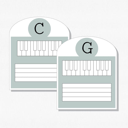 Two music cards with a keyboard and staff. Shown on a neutral colored background.