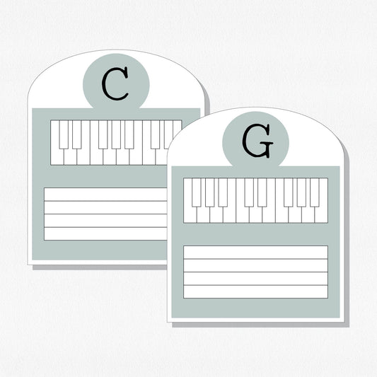 Two music cards with a keyboard and staff. Shown on a neutral colored background.