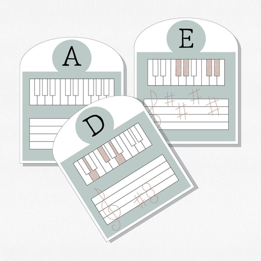 Three music theory cards with keyboards and staffs. Shown on a neutral colored background.