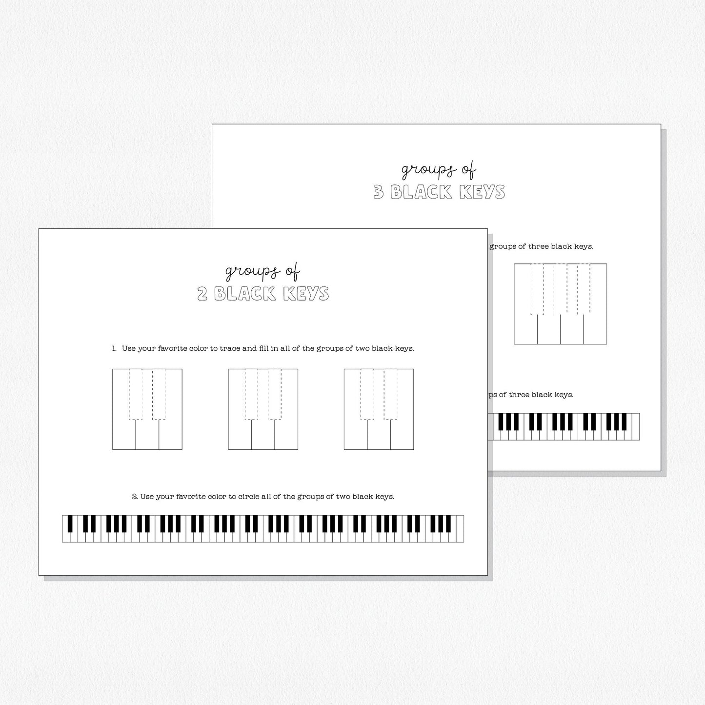 Photo of music theory worksheets on a neutral colored background.