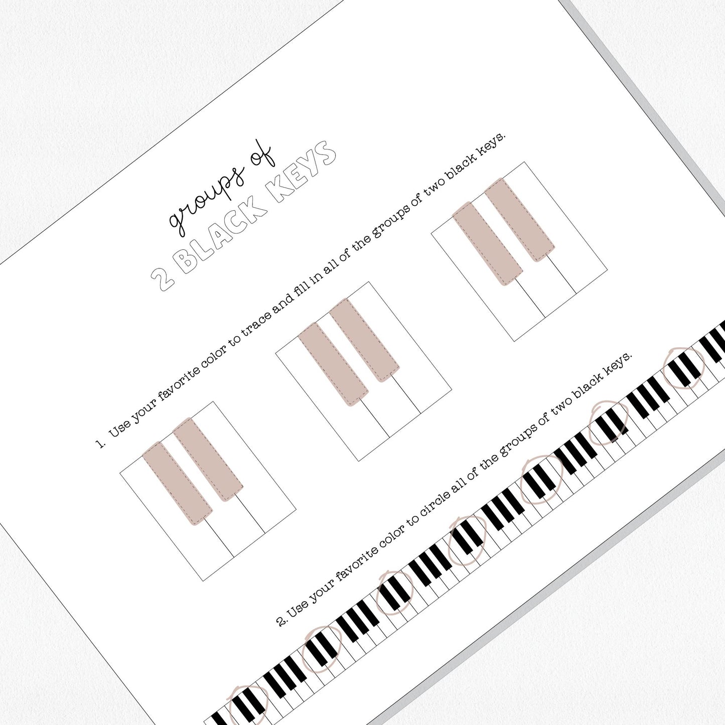 Photo of a music theory worksheet on a neutral colored background.