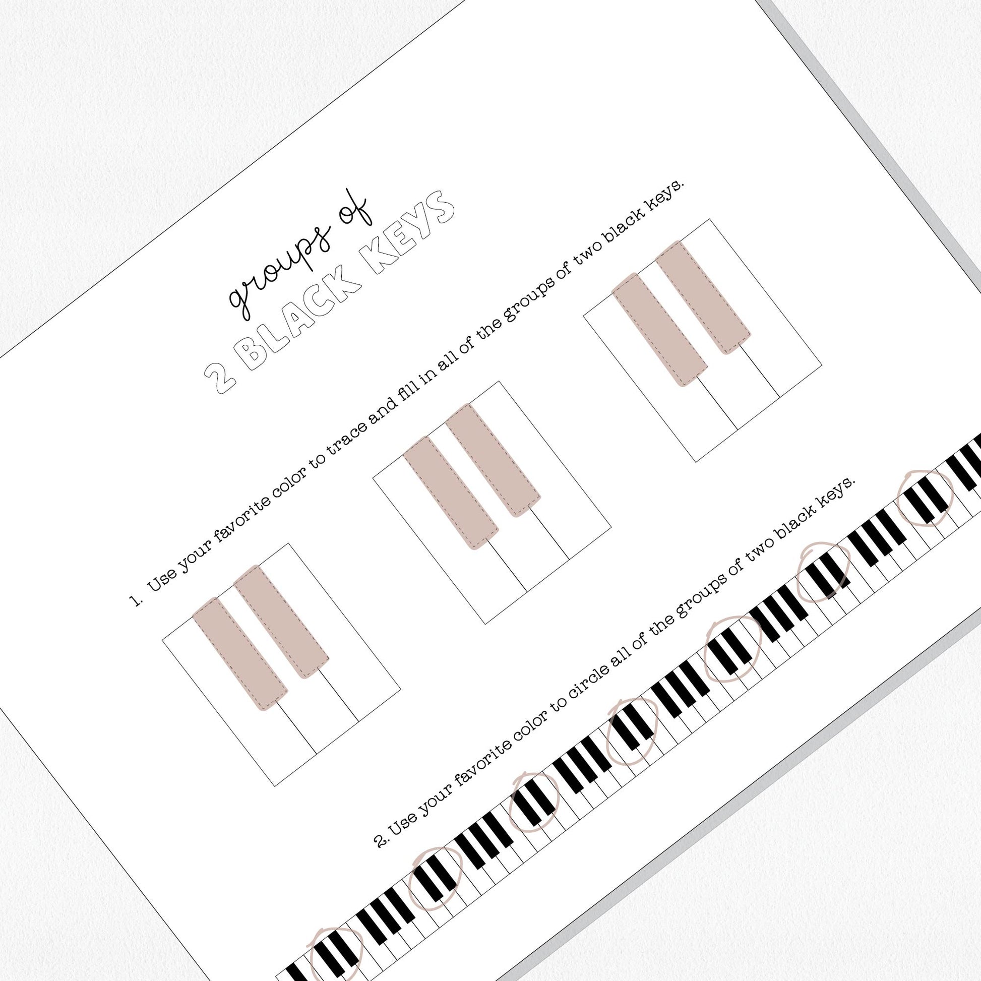 Photo of a music theory worksheet on a neutral colored background.